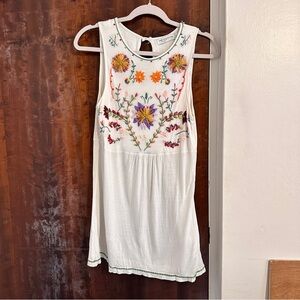 Embroidered white top.